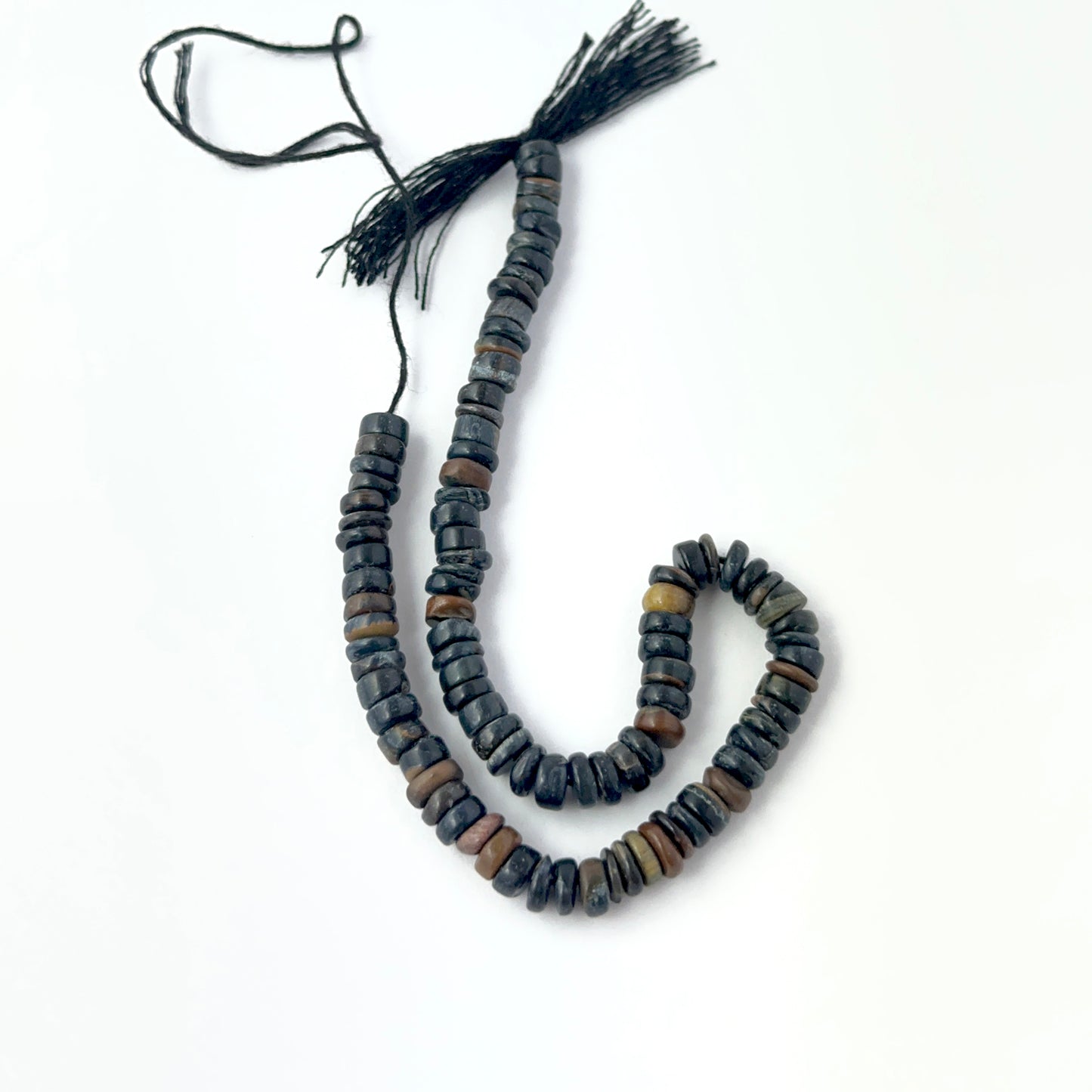 Tiger Eye smooth wheel gemstone beads, 5–5.5mm size, arranged on a 21cm strand for handmade jewellery makers.