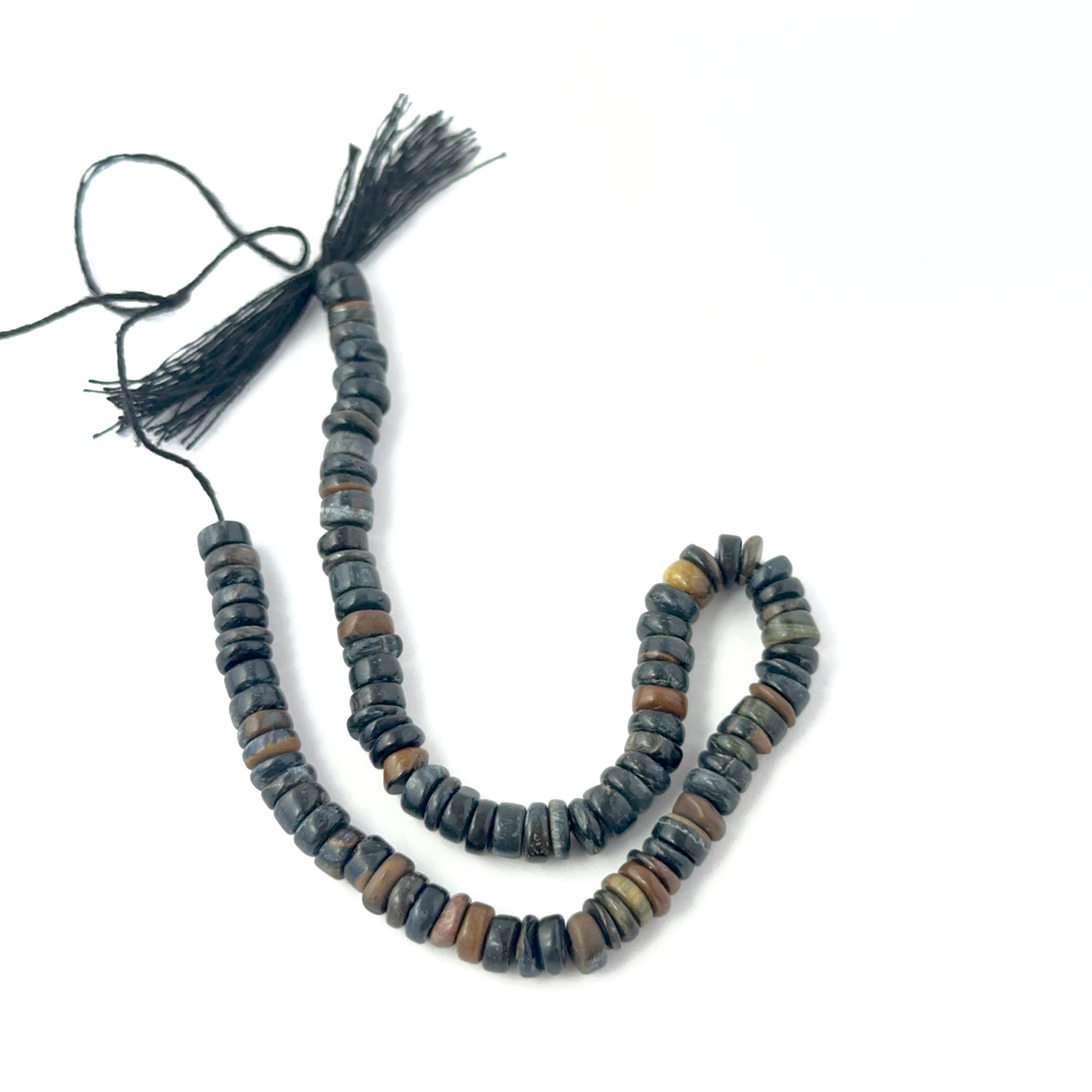 Genuine Tiger Eye stone beads in smooth wheel cut, showcasing golden‑brown chatoyancy for DIY jewellery design.
