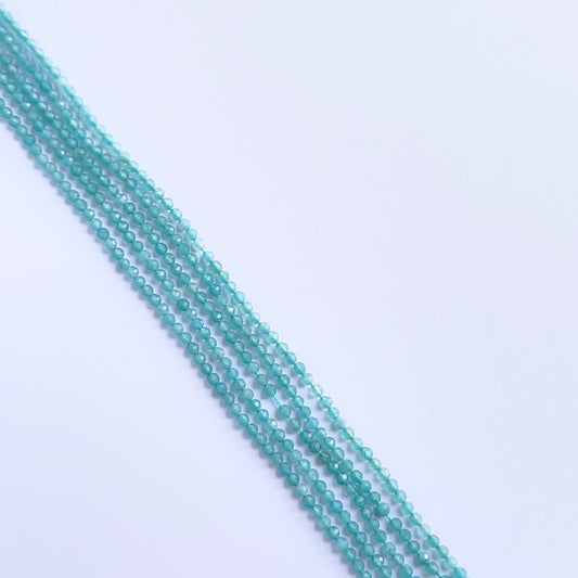 Chalcedony faceted rondelle beads in soft tones, arranged on a 32cm strand.