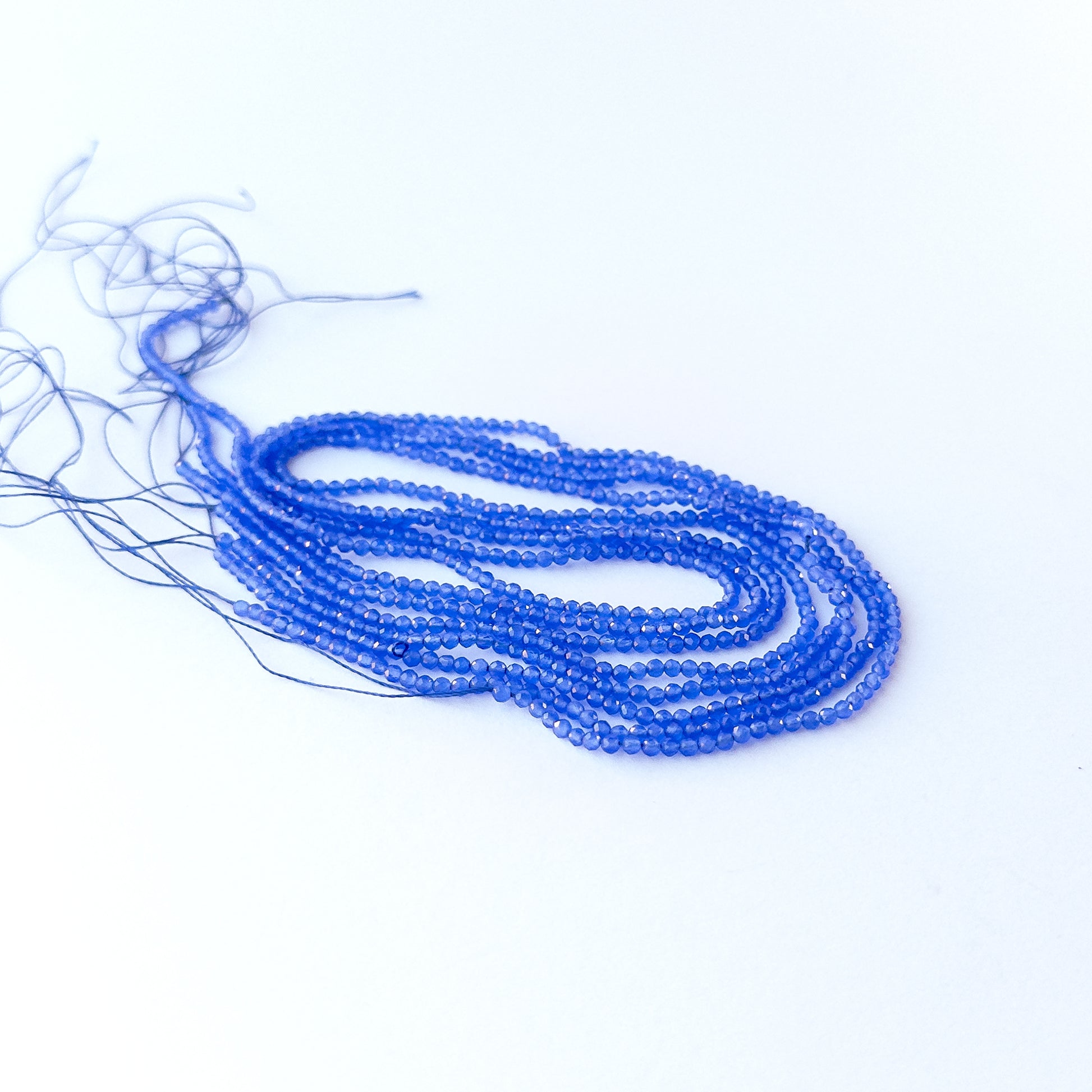 Blue Chalcedony faceted rondelle 2.1mm genuine gemstone beads arranged in a soft blue 35cm strand for handmade jewellery.
