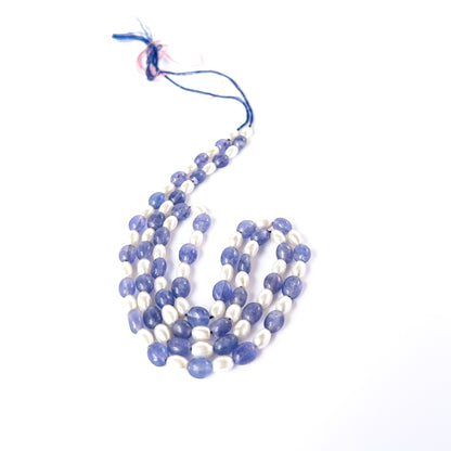 Blue Quartz and Shell Pearl smooth oval beads arranged on a long strand for handmade jewellery components.