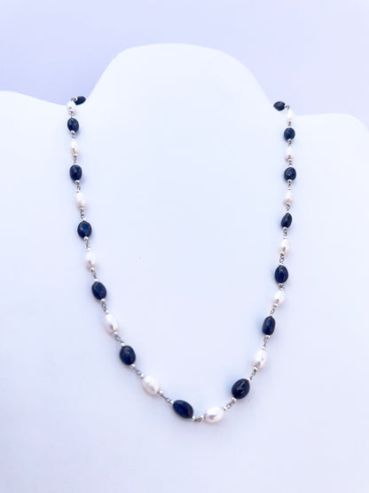 Handmade jewellery components in a Sapphire and Pearl necklace with refined oval cut and lustrous shine.