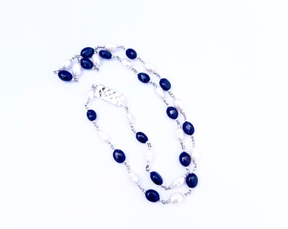 Elegant two‑strand sapphire and freshwater pearl necklace showcasing smooth oval beads.