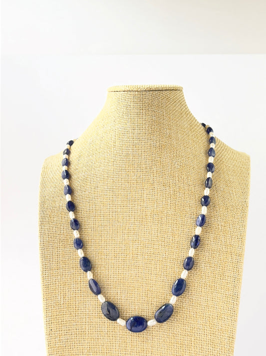 Single‑strand necklace featuring smooth oval blue sapphire and freshwater pearl beads sized 6.5–12.4mm.
