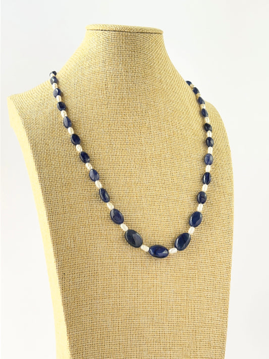 Elegant sapphire and pearl necklace crafted with smooth oval beads in a 52cm adjustable design.