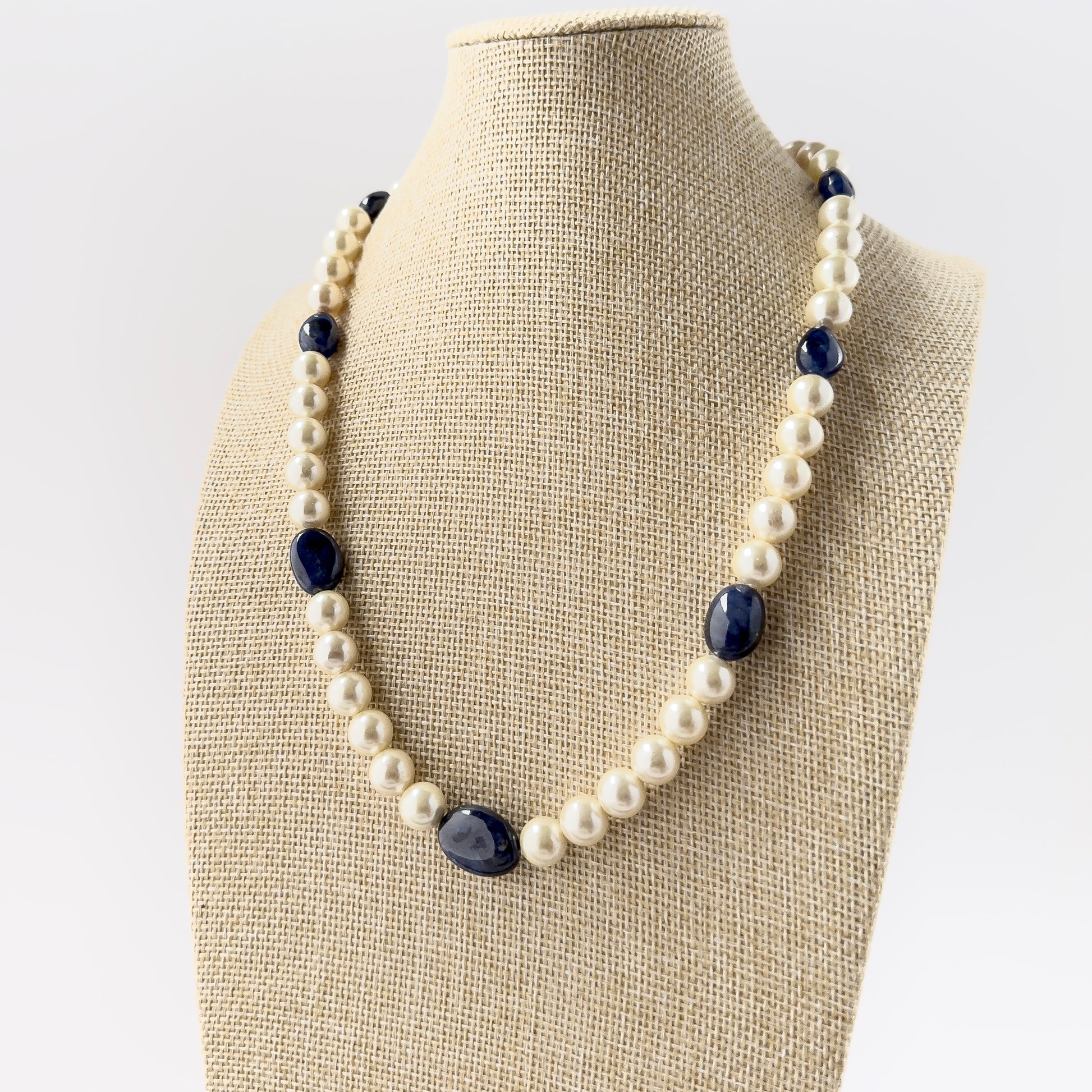Genuine Blue Sapphire and Freshwater Pearl smooth round beads arranged in a refined necklace design with rich colour contrast.