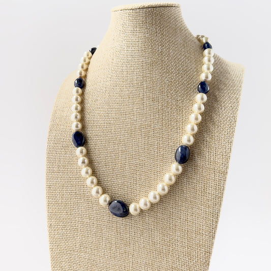 Genuine Blue Sapphire and Freshwater Pearl smooth round beads arranged in a refined necklace design with rich colour contrast.