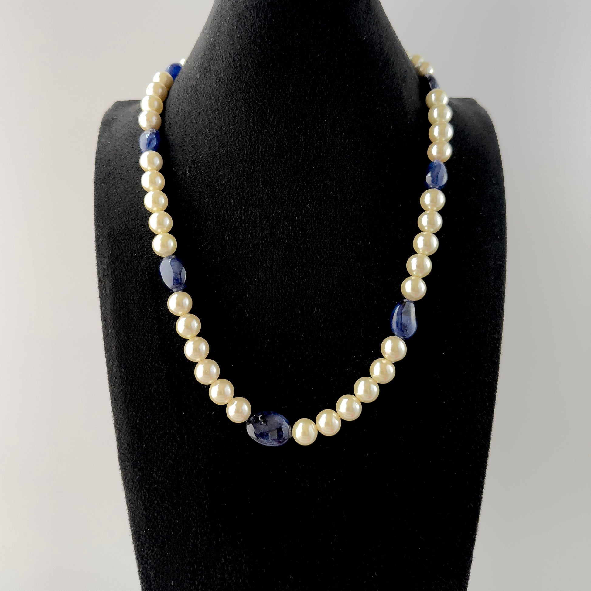 Handmade jewellery showcasing Blue Sapphire beads paired with luminous Freshwater Pearls in a smooth round finish.