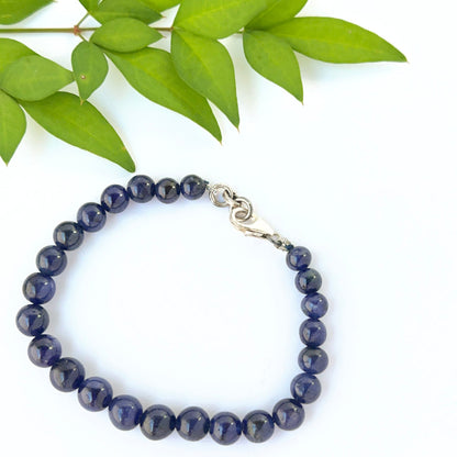 Blue sapphire bead bracelet arranged in a classic 16cm smooth round style.