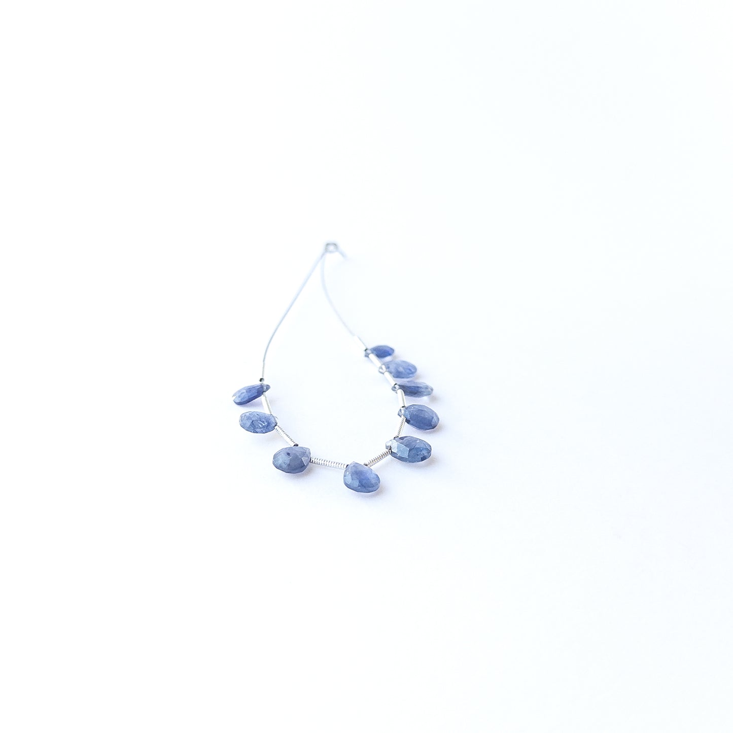 Blue Sapphire faceted briolette beads displaying natural colour variation and premium craftsmanship.