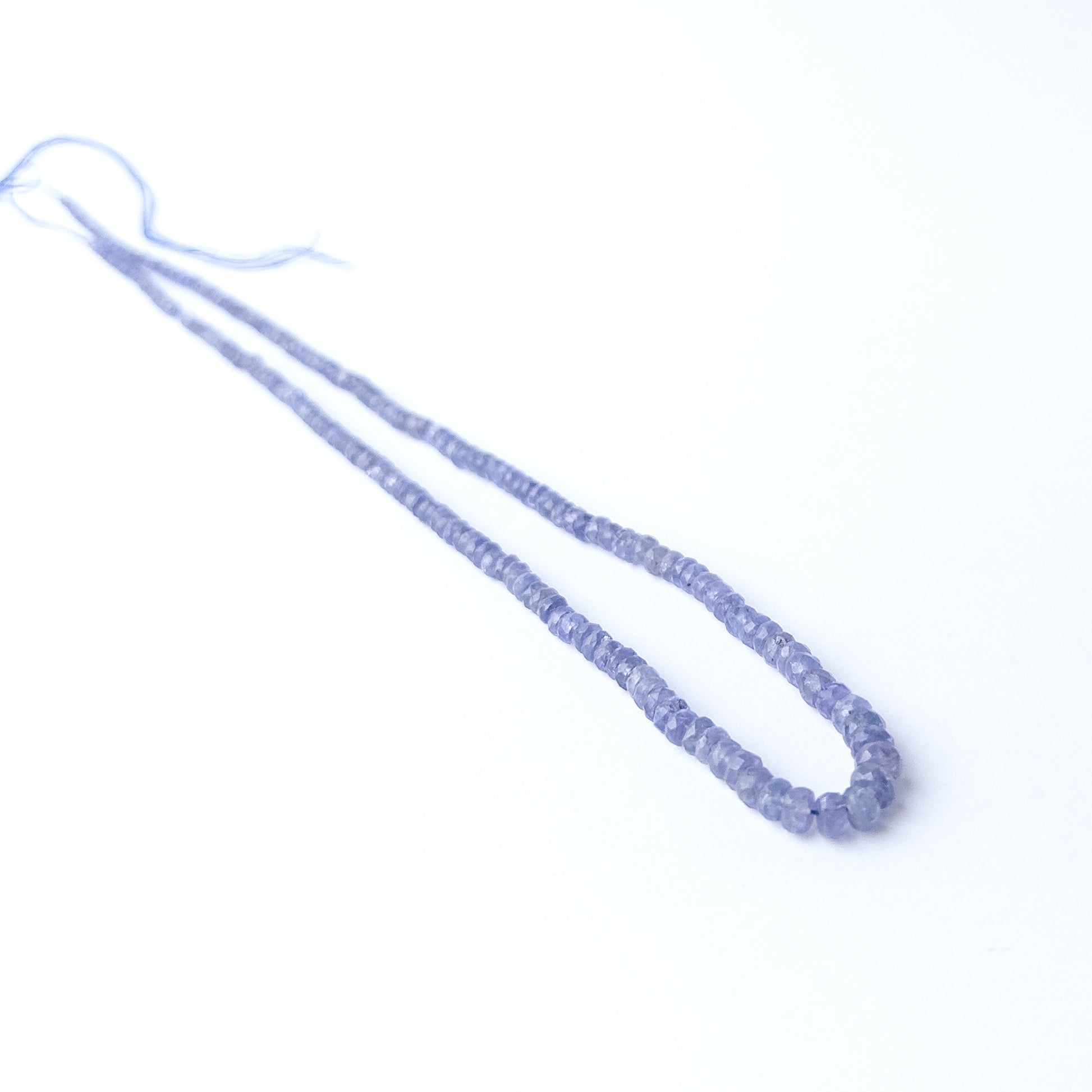 Shimmering Blue Sapphire rondelle beads with brilliant facets, genuine stone beads ideal for detailed beadwork and crafting.