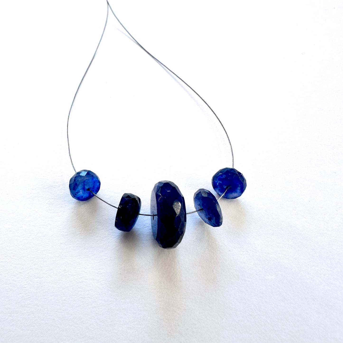 Five-piece Blue Sapphire faceted rondelle set, 26 carats, ideal for natural gemstone beads in elegant jewellery designs.