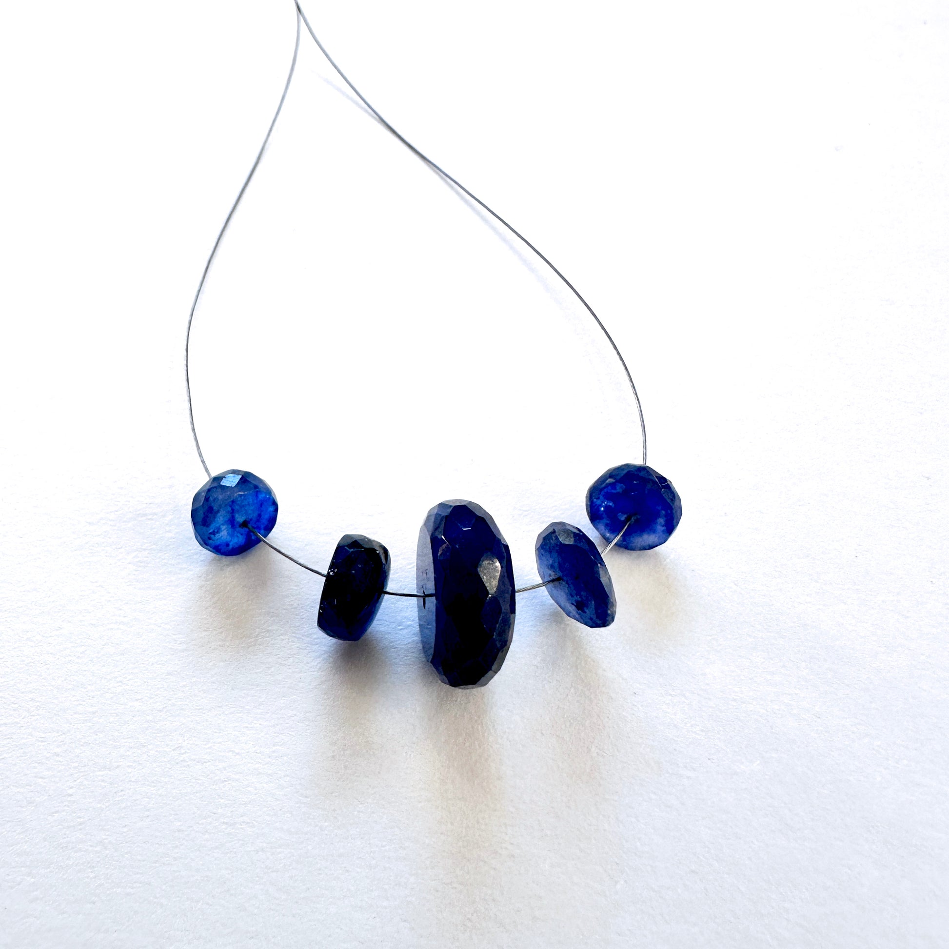 Five-piece Blue Sapphire faceted rondelle set, 26 carats, ideal for natural gemstone beads in elegant jewellery designs.