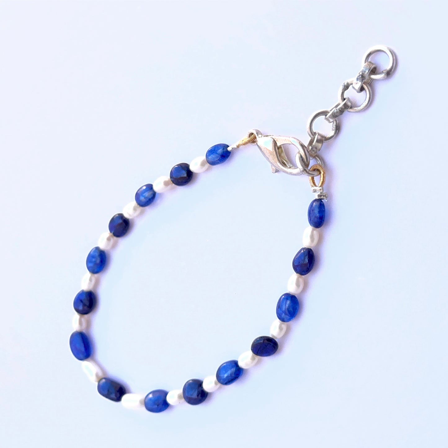 Sapphire and pearl bracelet with smooth oval beads showing soft shine and colour.