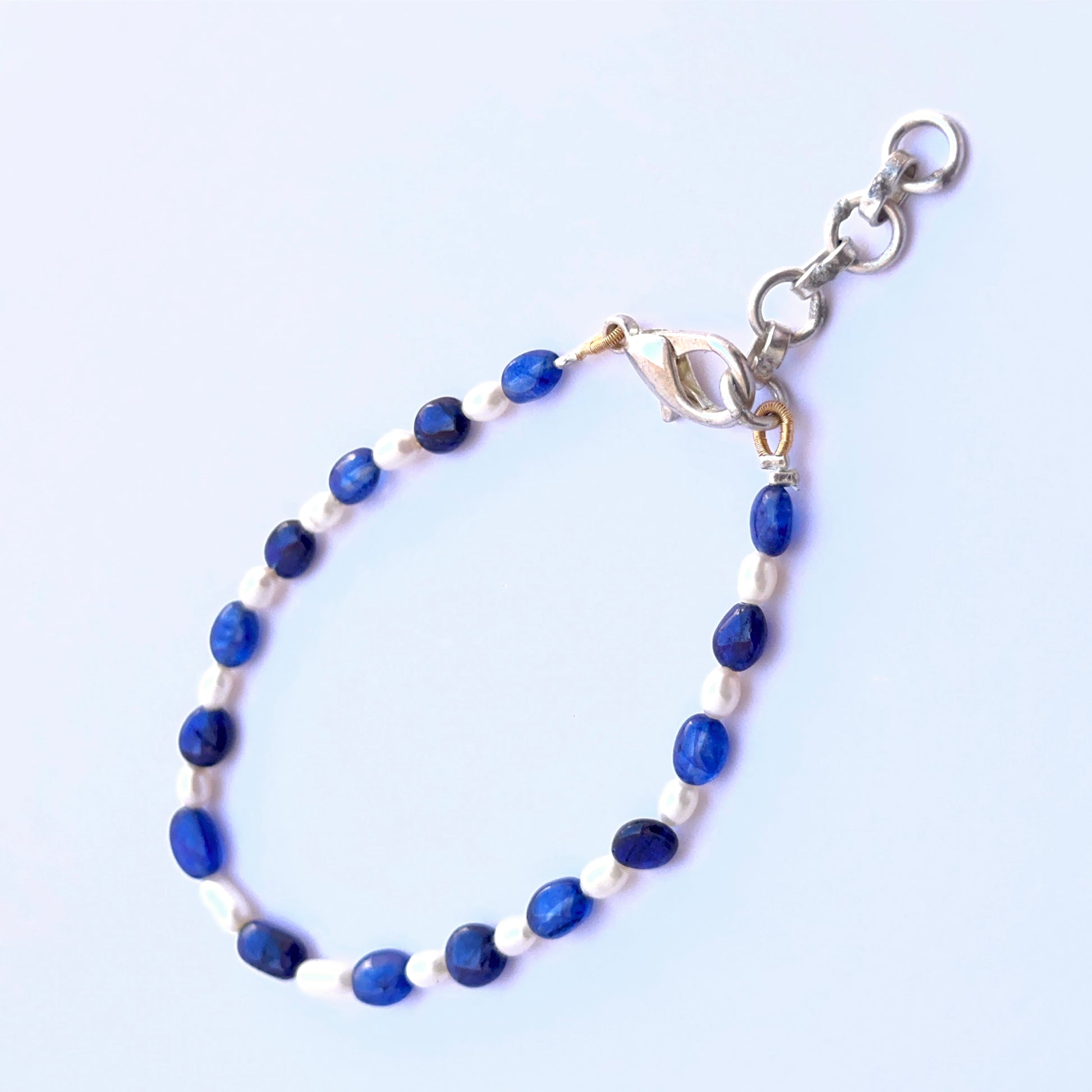 Sapphire and pearl bracelet with smooth oval beads showing soft shine and colour.