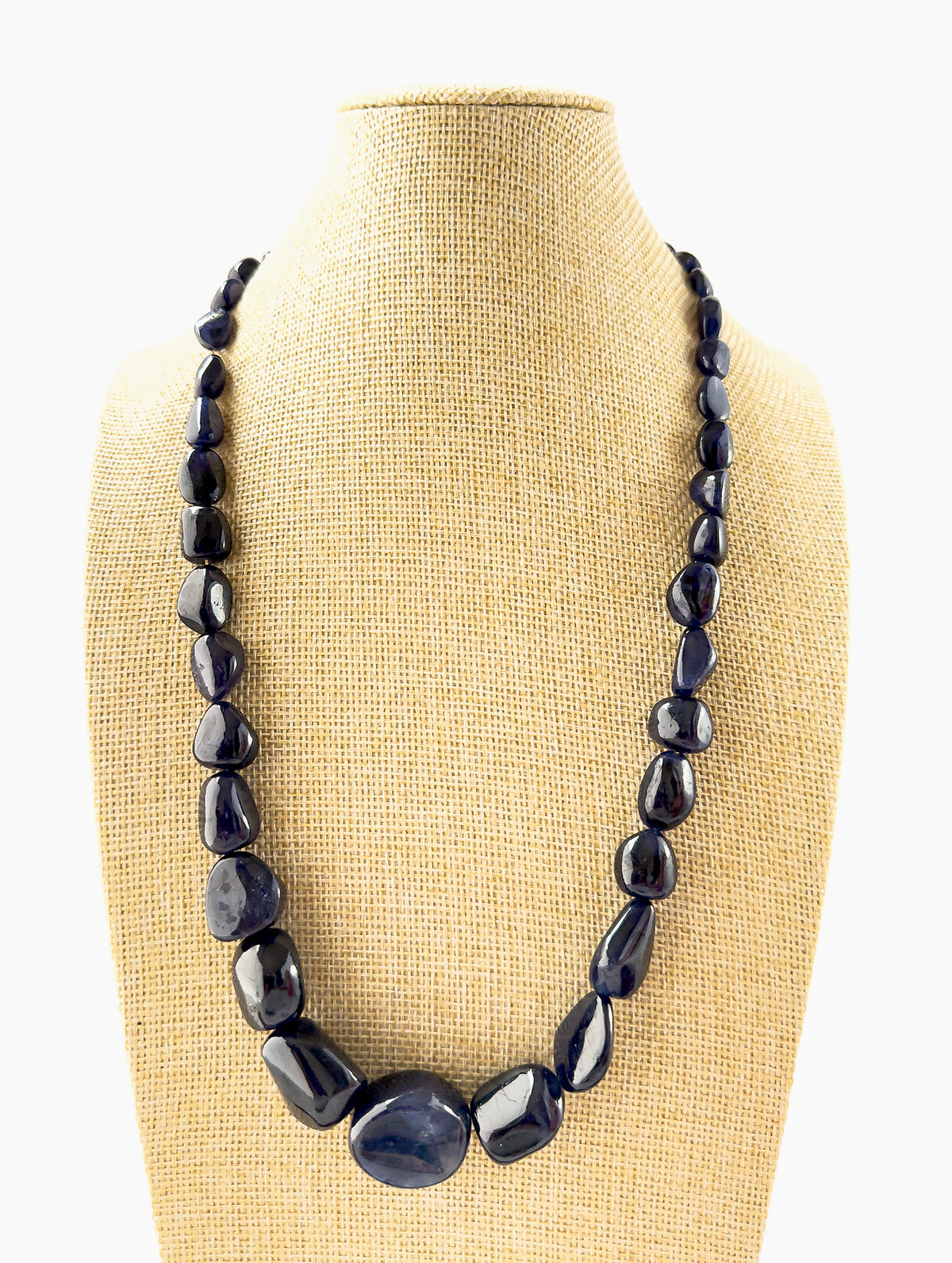 Blue Sapphire tumbled beads in 8.5–22mm sizes arranged in a 54cm adjustable necklace, showcasing deep blue tones and organic polished shapes.