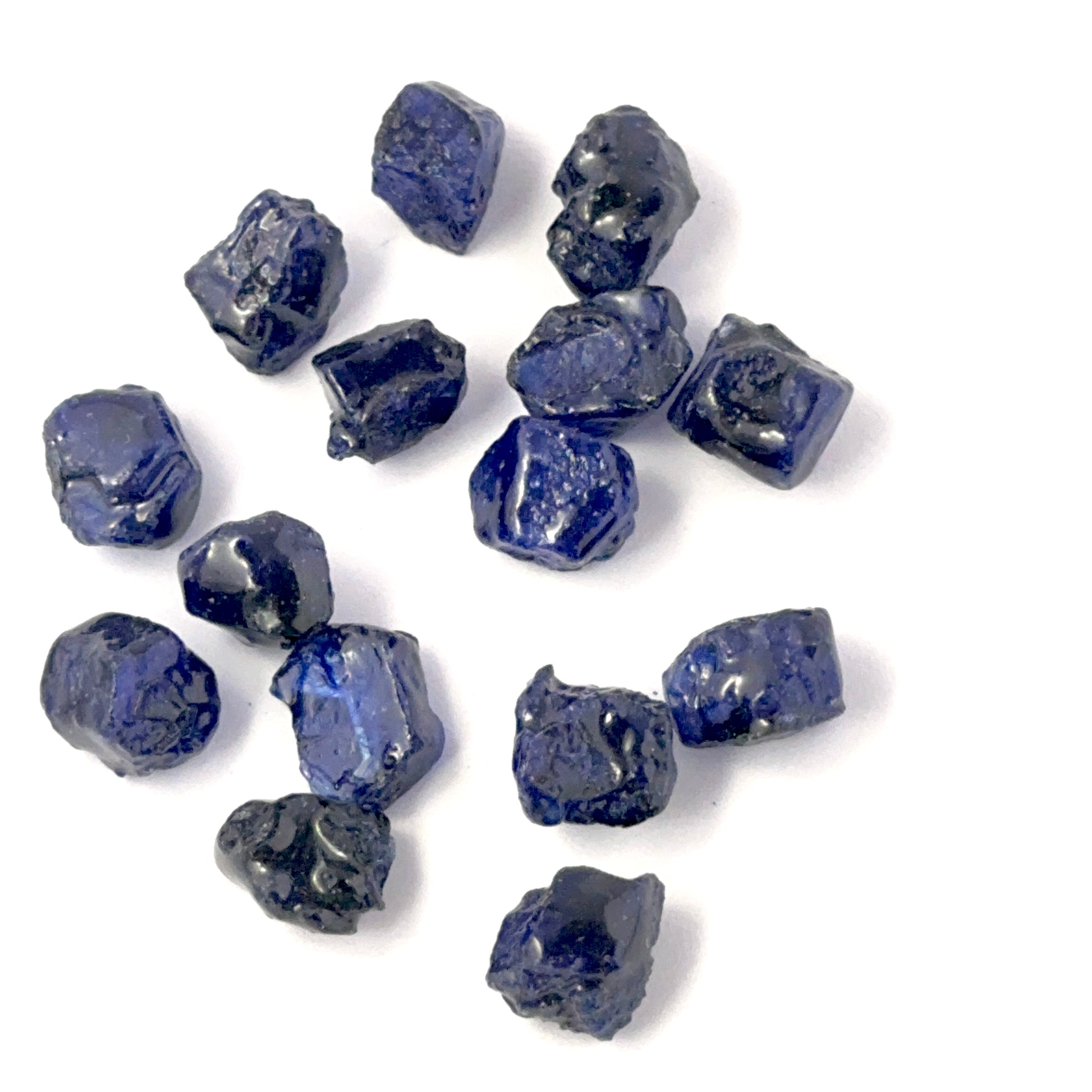 Blue Sapphire rough undrilled stones showing deep blue tones and natural texture, ideal for genuine gemstone beads in DIY jewellery.