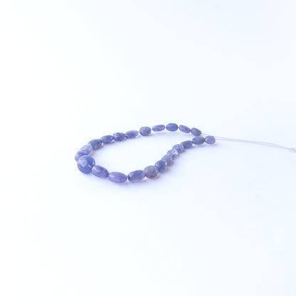 Blue Sapphire smooth oval beads displaying natural colour variation and premium craftsmanship.