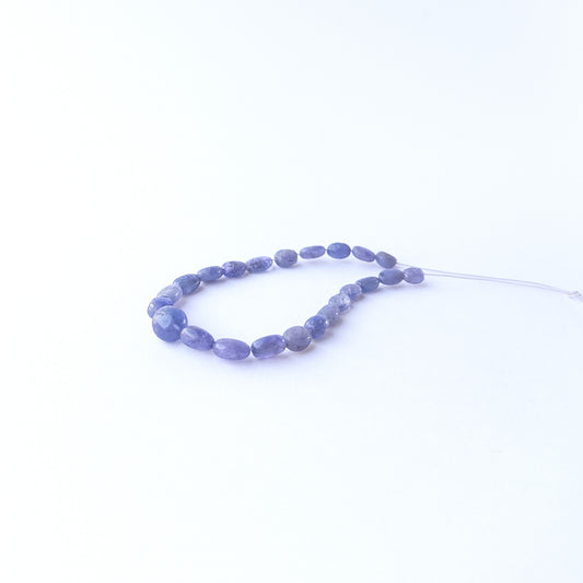 Blue Sapphire smooth oval beads displaying natural colour variation and premium craftsmanship.