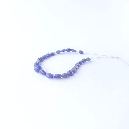 Blue Sapphire oval beads showcasing natural shine and elegant shape for gemstone bead creators.