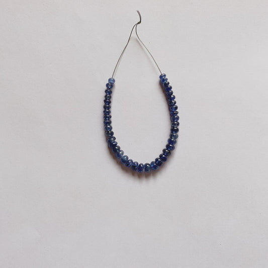 Blue Sapphire rondelle beads in rich blue tones, 3.8–5.2mm size, arranged in a unique 39-piece set.