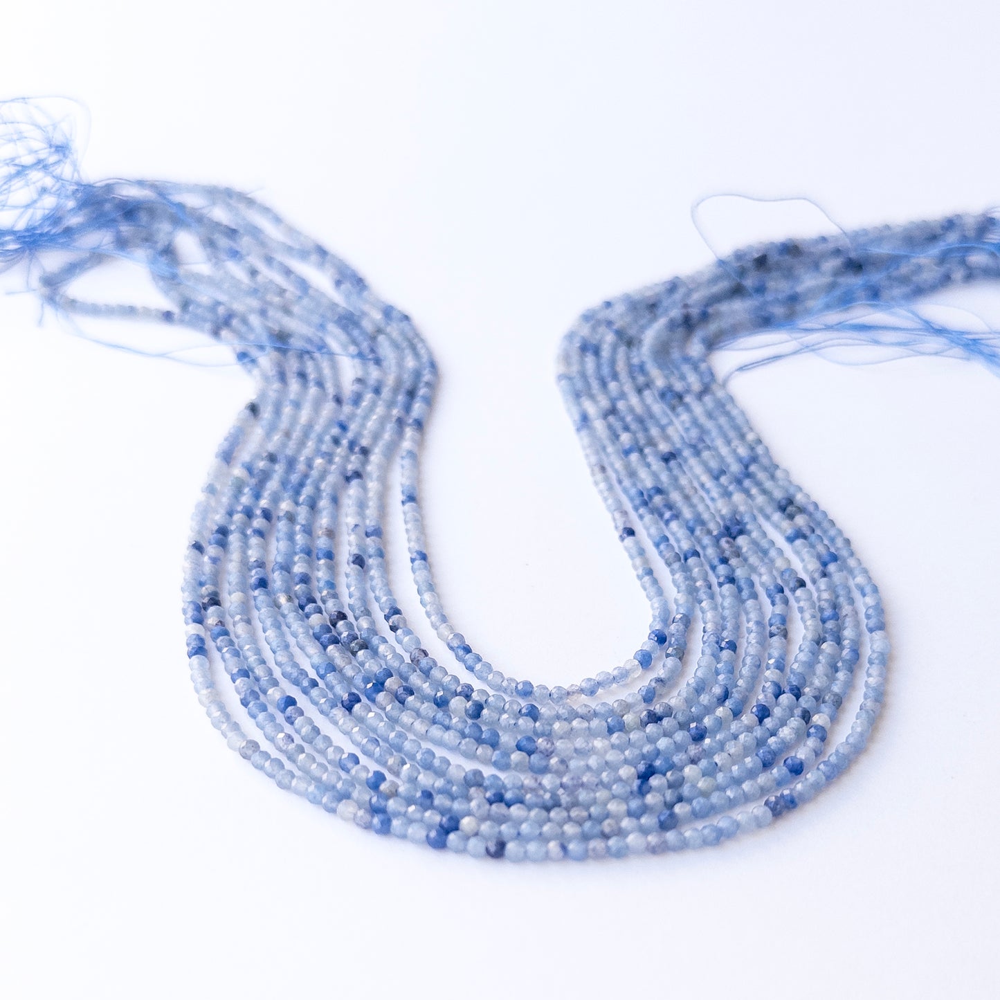 Authentic Blue Shaded Chalcedony gemstone beads showing subtle colour shifts and sparkle for beadwork.