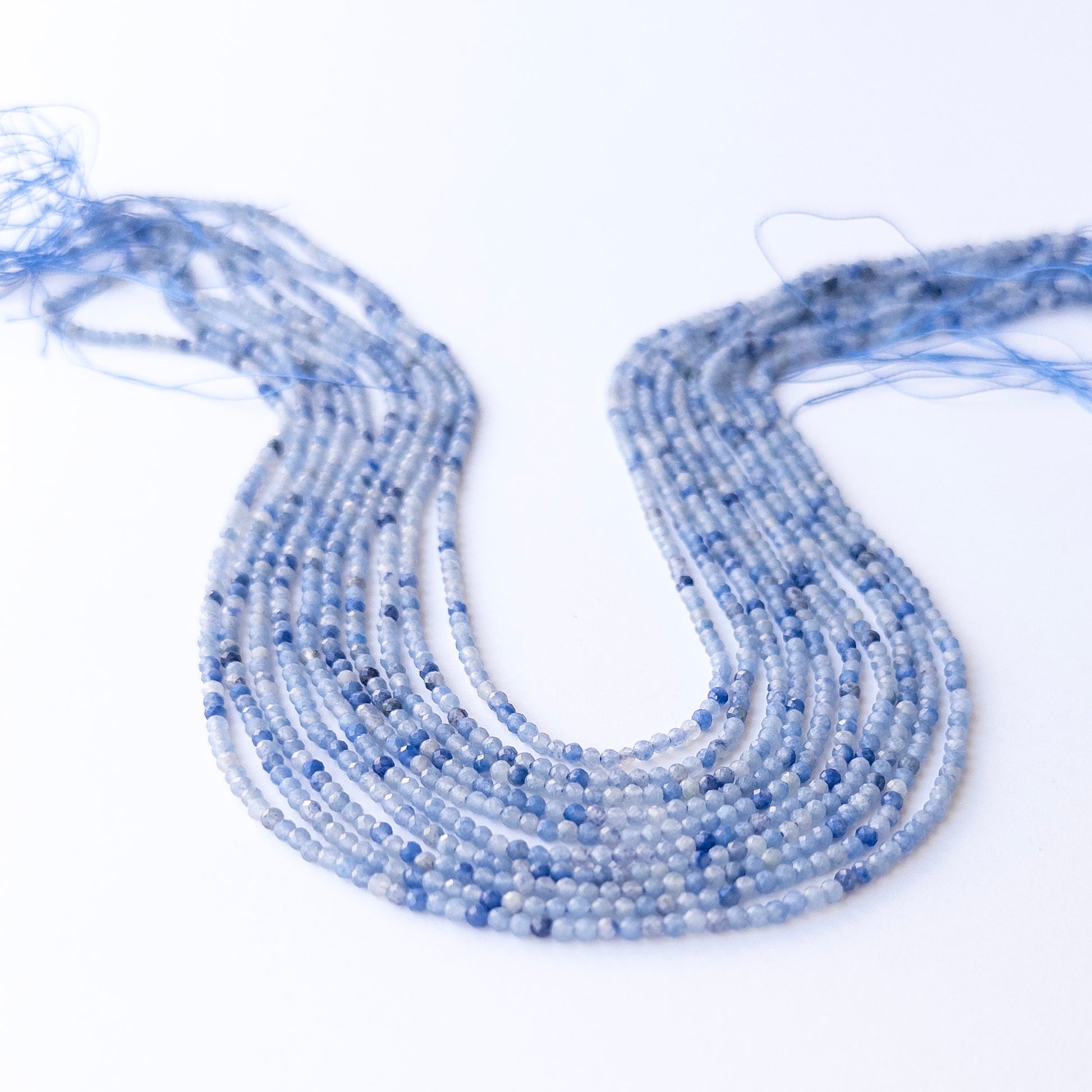 Authentic Blue Shaded Chalcedony gemstone beads showing subtle colour shifts and sparkle for beadwork.