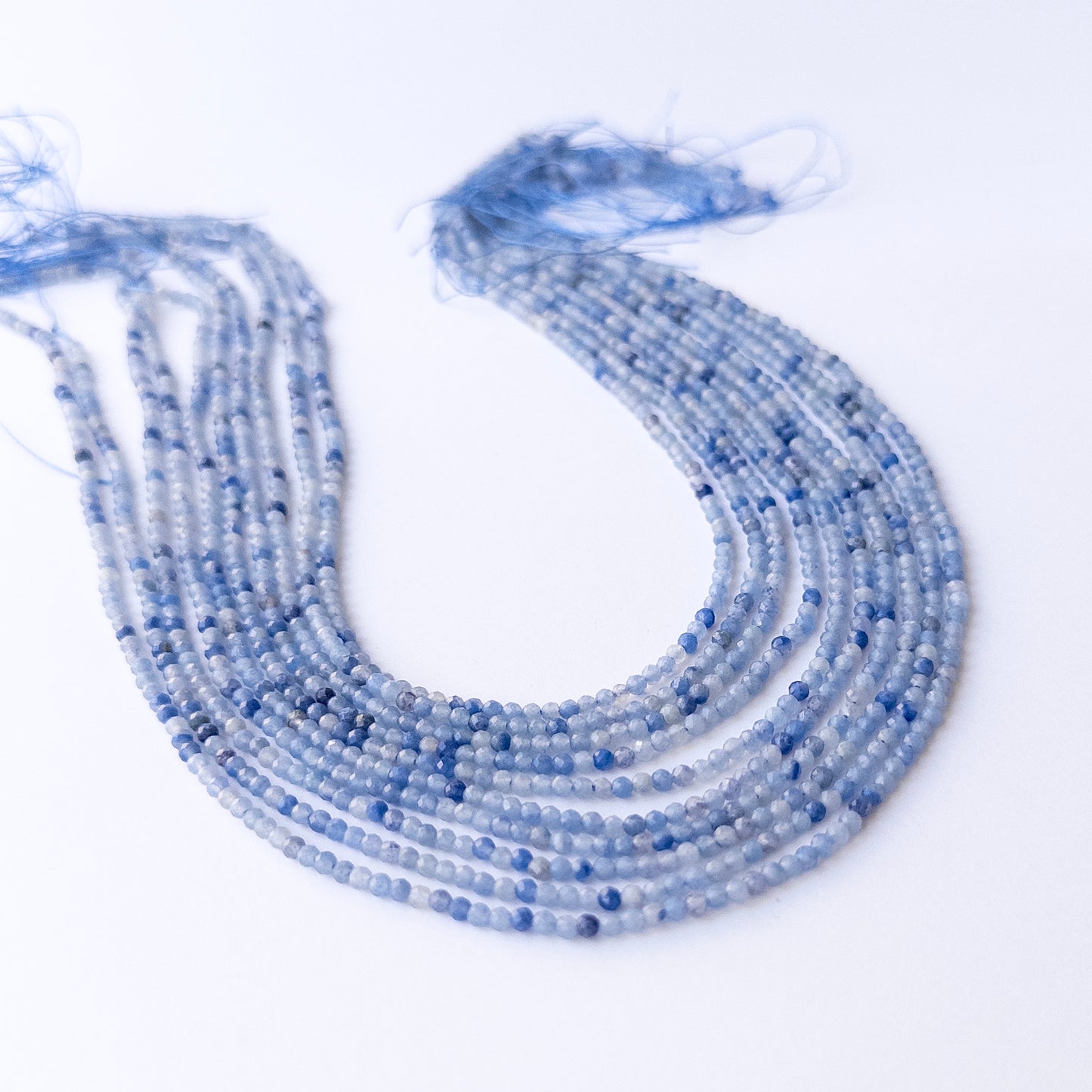 Delicate Blue Shaded Chalcedony micro‑faceted beads showcasing shimmer and clarity for DIY designs.