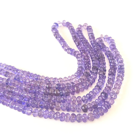 Brazilian Amethyst faceted rondelle beads 6.5–8.5mm showing rich purple colour and natural shine on a 35cm strand.
