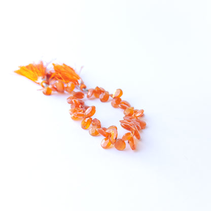 Handmade jewellery components featuring smooth, sparkling Carnelian briolette gemstone beads.