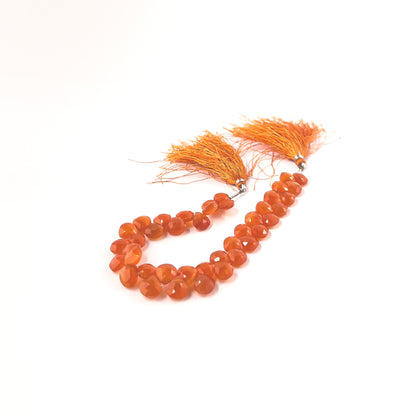 Authentic Carnelian stone beads in faceted briolette cut, ideal for DIY jewellery and artisan beadwork with vibrant colour.