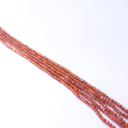 Genuine Carnelian gemstone beads in faceted rondelle shape, displaying polish, shimmer, and natural beauty for jewellery crafting.