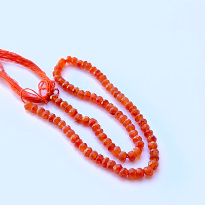 Close‑up of 4.3–4.5mm Carnelian stone beads showing sparkling facets and warm colour ideal for natural gemstone beads for DIY jewellery.