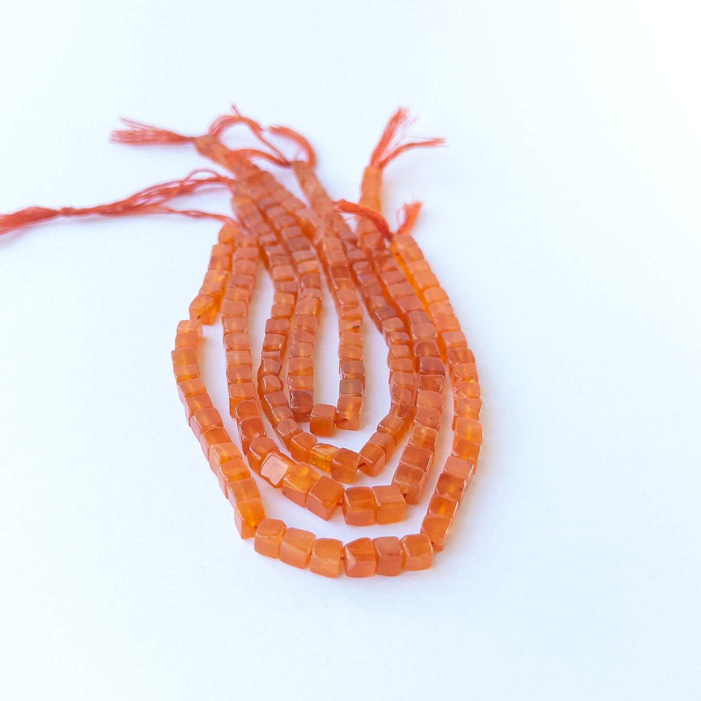 High‑quality Carnelian cube stone beads with glossy finish and rich warm tones for jewellery making.