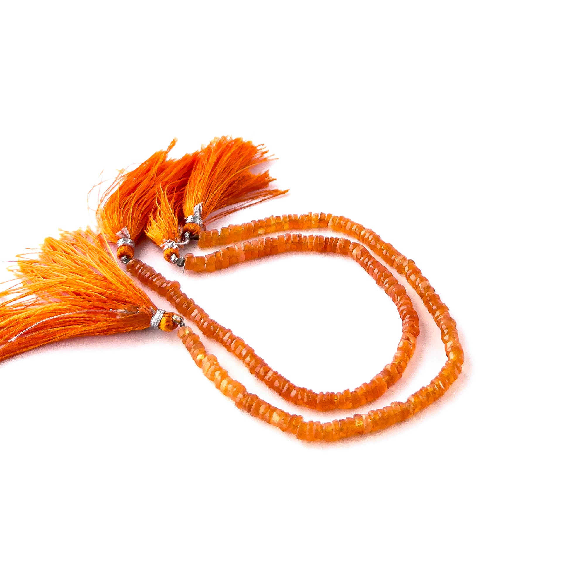 Carnelian smooth wheel heishi beads in 4.5–5mm size arranged in a 21cm strand with warm orange tones and polished shine.