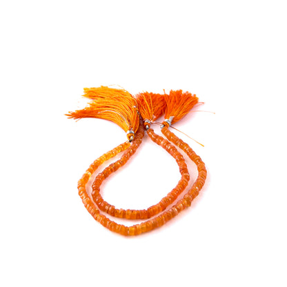 Handmade jewellery components featuring Carnelian smooth heishi beads with vibrant colour and uniform shaping.