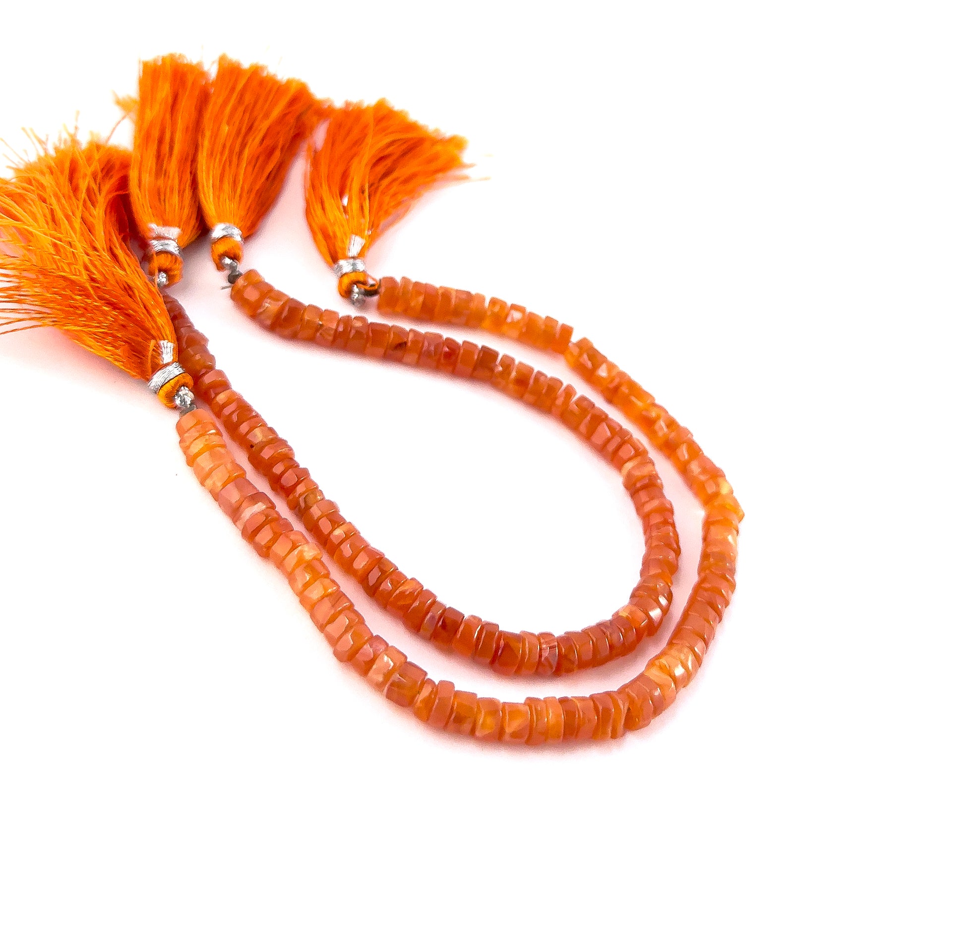Carnelian smooth wheel heishi gemstones with rounded shaping and vibrant burnt‑orange colour across a 20cm strand.
