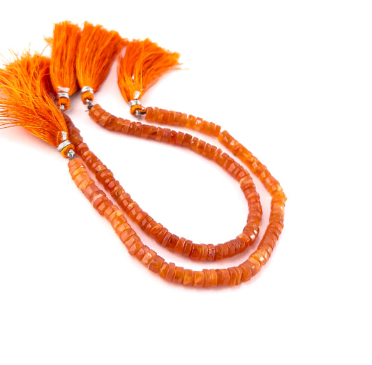 Carnelian smooth wheel heishi gemstones with rounded shaping and vibrant burnt‑orange colour across a 20cm strand.