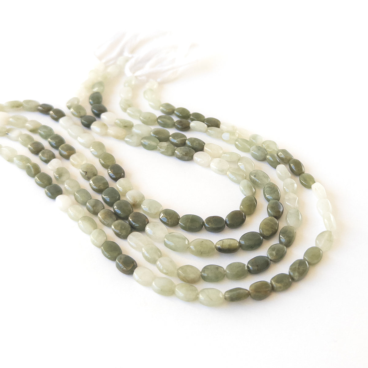 Authentic Cat’s Eye gemstone beads displaying natural glow and elegant oval shaping for DIY jewellery makers.