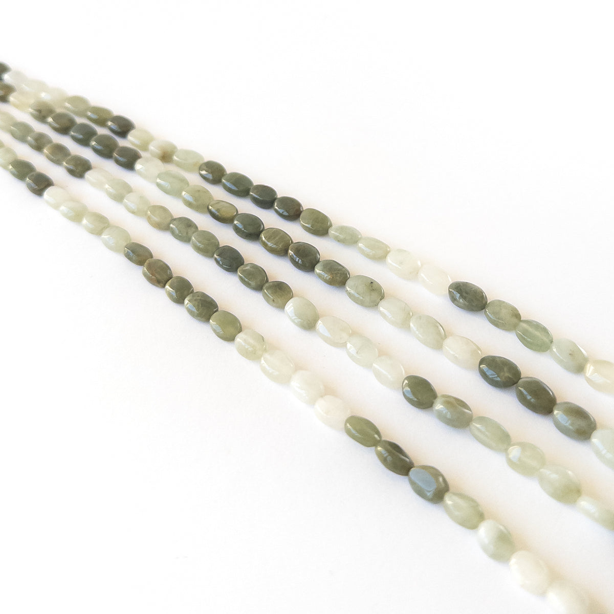 Natural Cat’s Eye gemstone beads with soft reflective sheen and premium clarity for elegant stone bead designs.