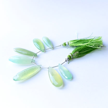 Handmade jewellery components featuring natural Chalcedony faceted briolettes, highlighting their clarity, colour, and elegant teardrop form.