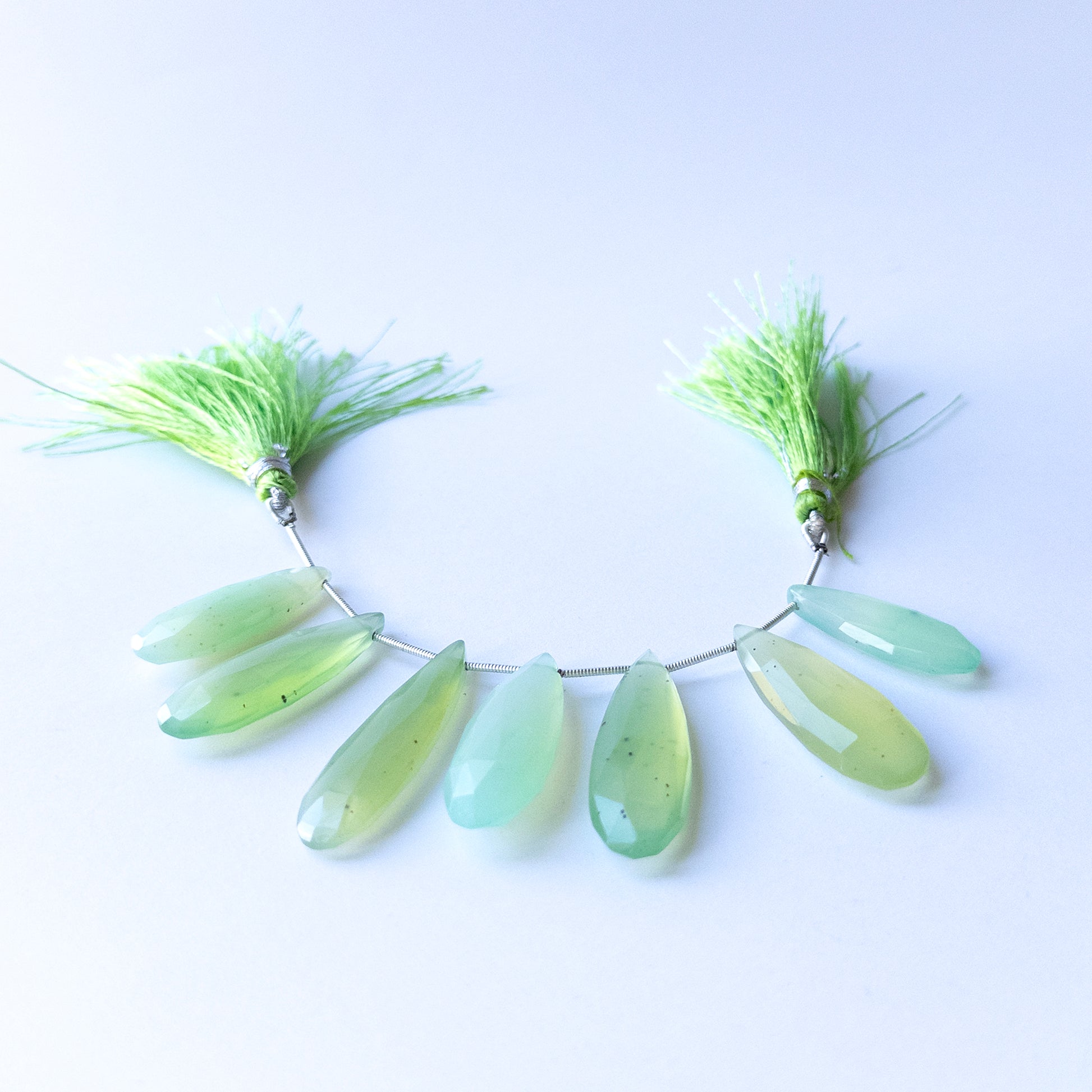Chalcedony faceted briolette beads in 28–39mm length and 10–13mm breadth, showcasing genuine gemstone shine for handmade jewellery.