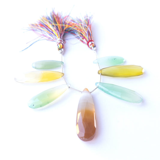 Chalcedony faceted briolette beads 27–45mm × 10–14mm shown as a set of seven pastel teardrop gemstones.