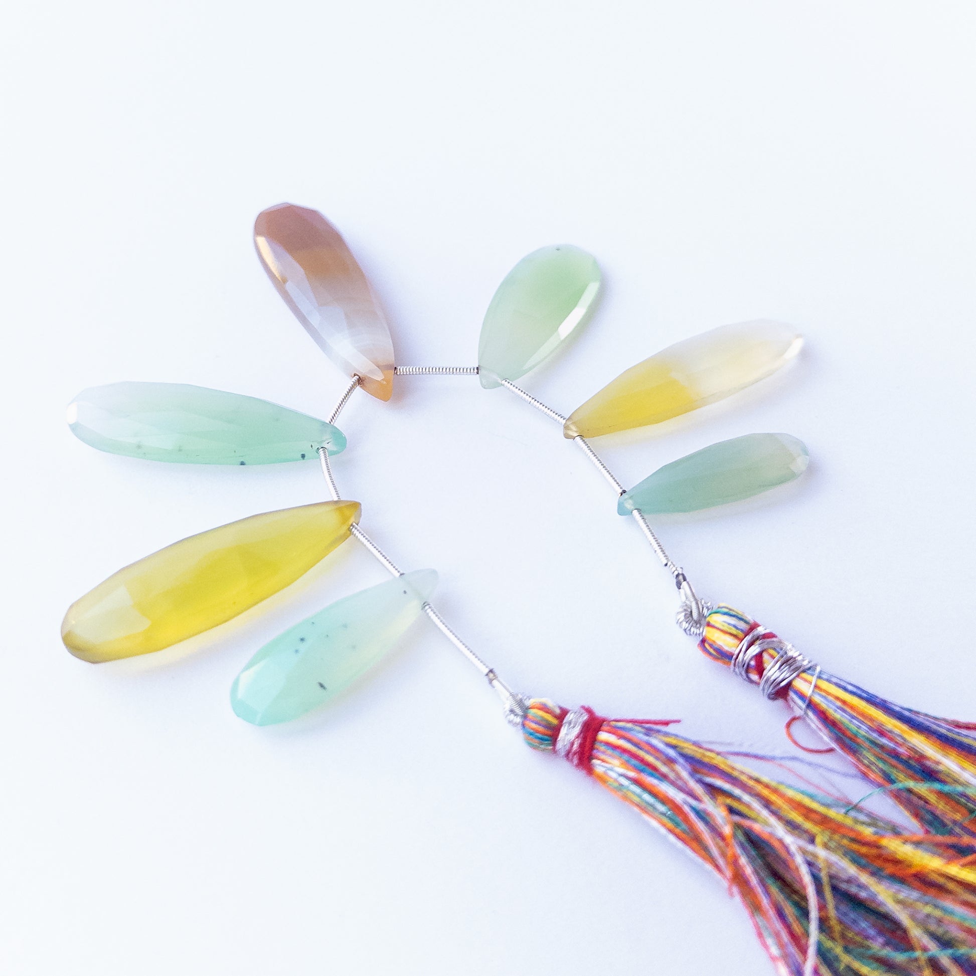 Handmade jewellery components featuring seven large Chalcedony faceted briolette beads with bright shine.