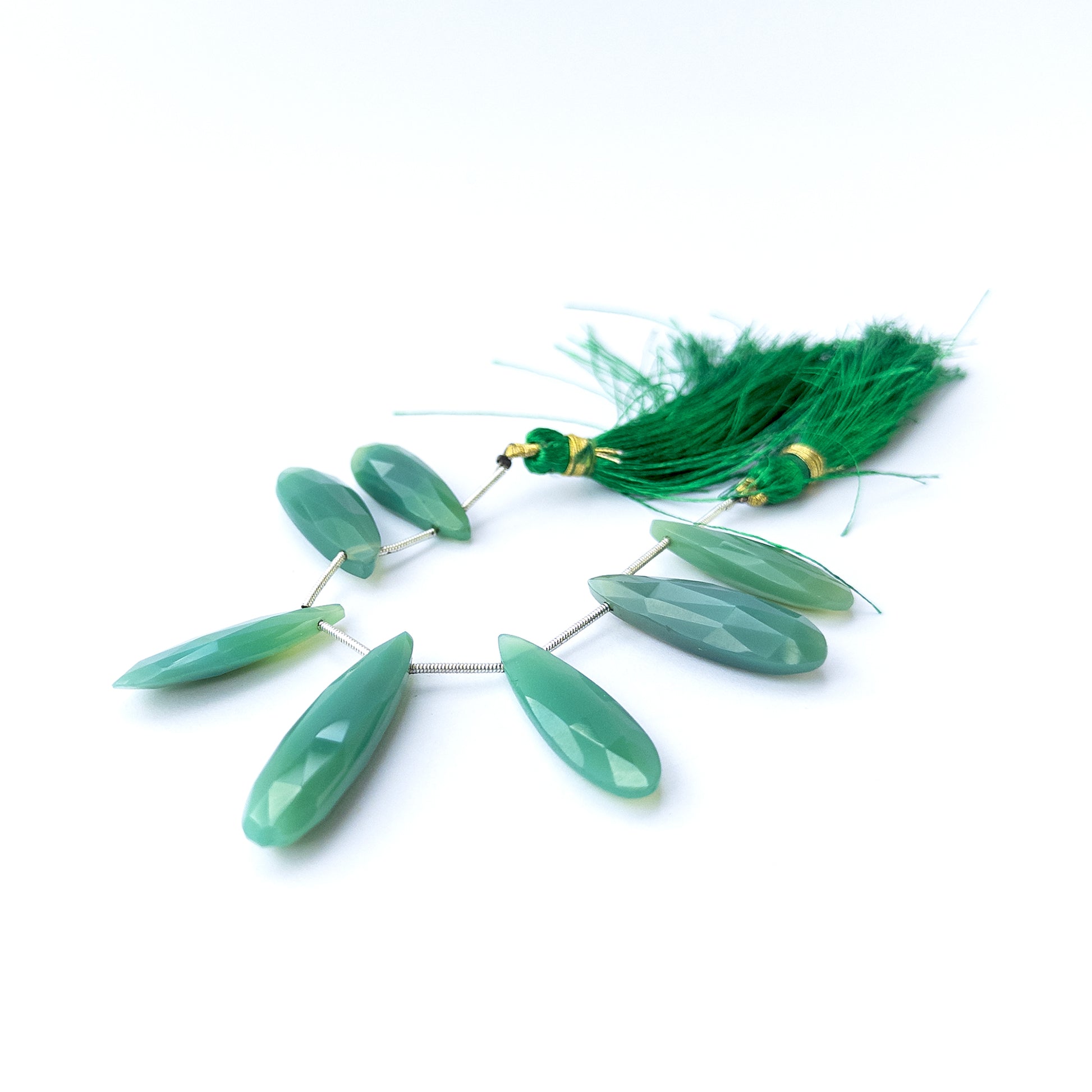 Natural Chalcedony stone beads with sparkling faceted briolette shapes, perfect for artisan jewellery components.