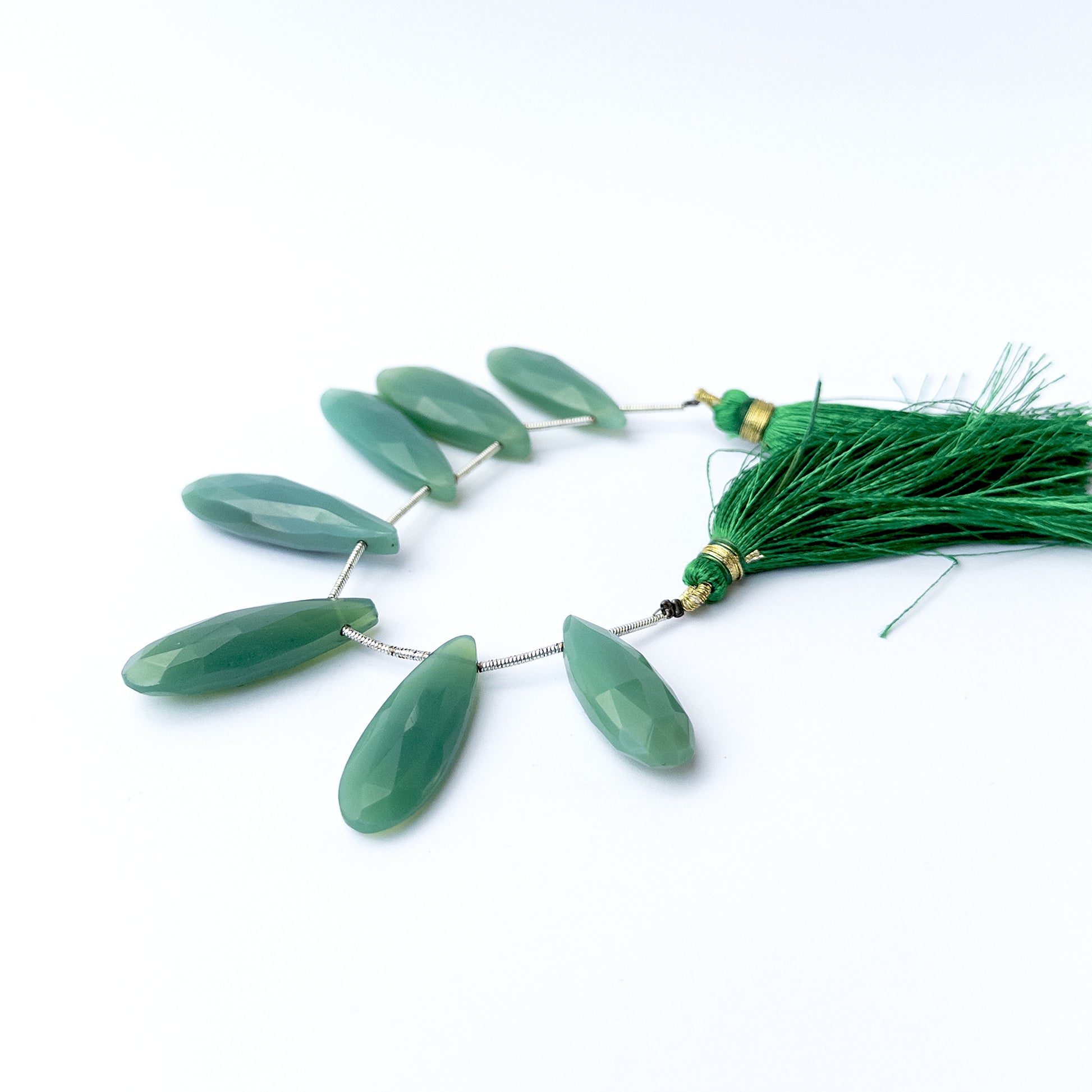 Natural Chalcedony stone beads with sparkling faceted briolette shapes, perfect for artisan jewellery components.