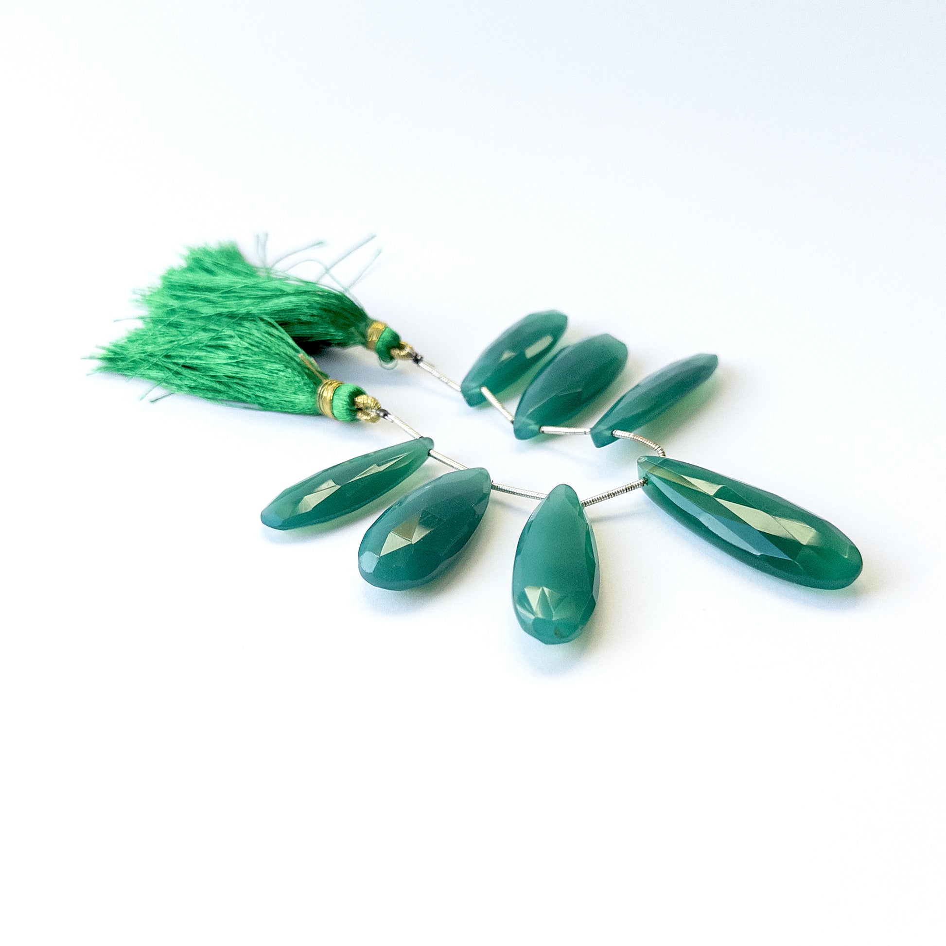 Natural Chalcedony stone beads with sparkling faceted briolette shapes, perfect for artisan jewellery components.