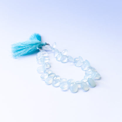 Natural Chalcedony stone beads with polished faceted briolette shapes, perfect for artisan jewellery designs.
