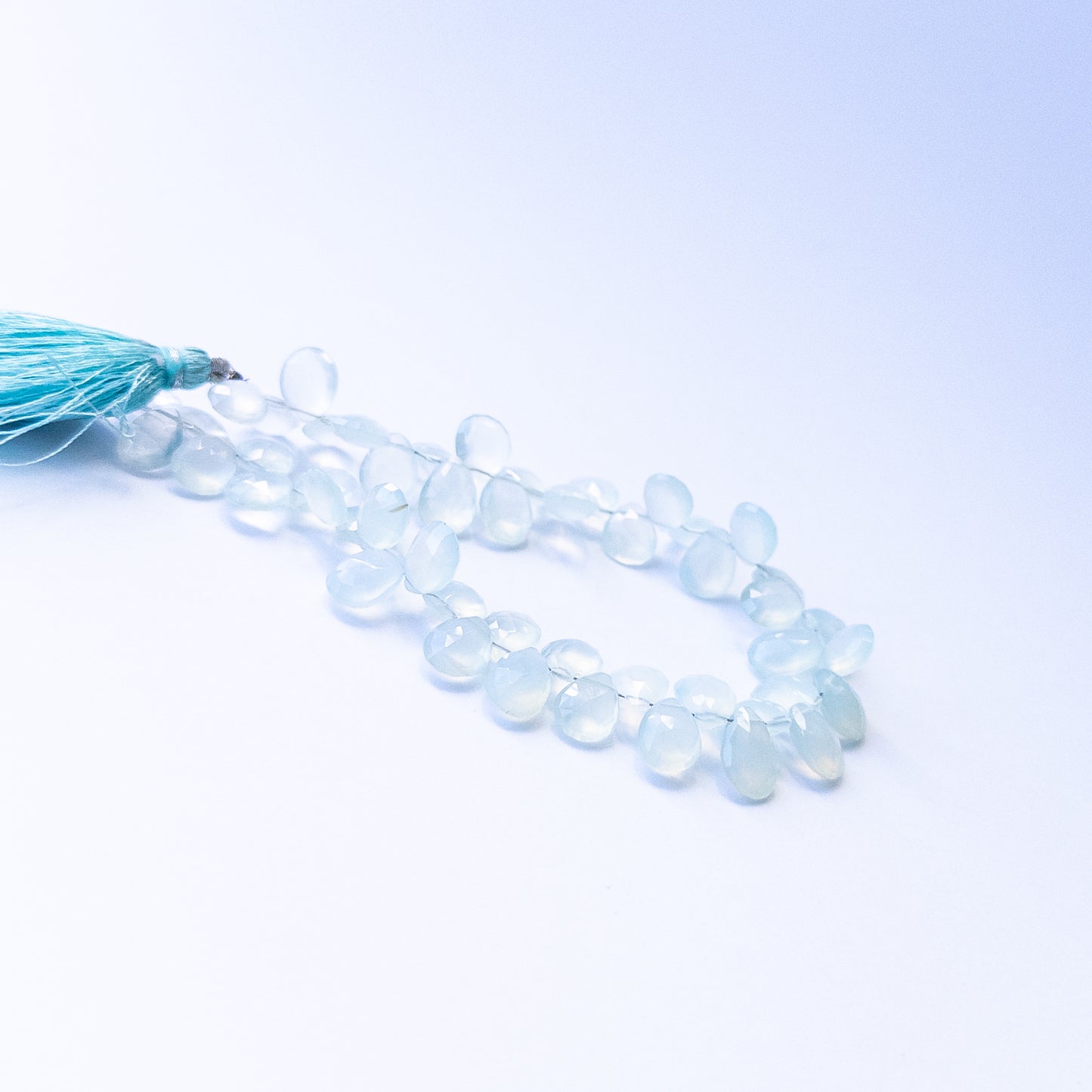 Chalcedony faceted briolette gemstone beads in 7–8mm sizes, genuine stones for handmade jewellery.