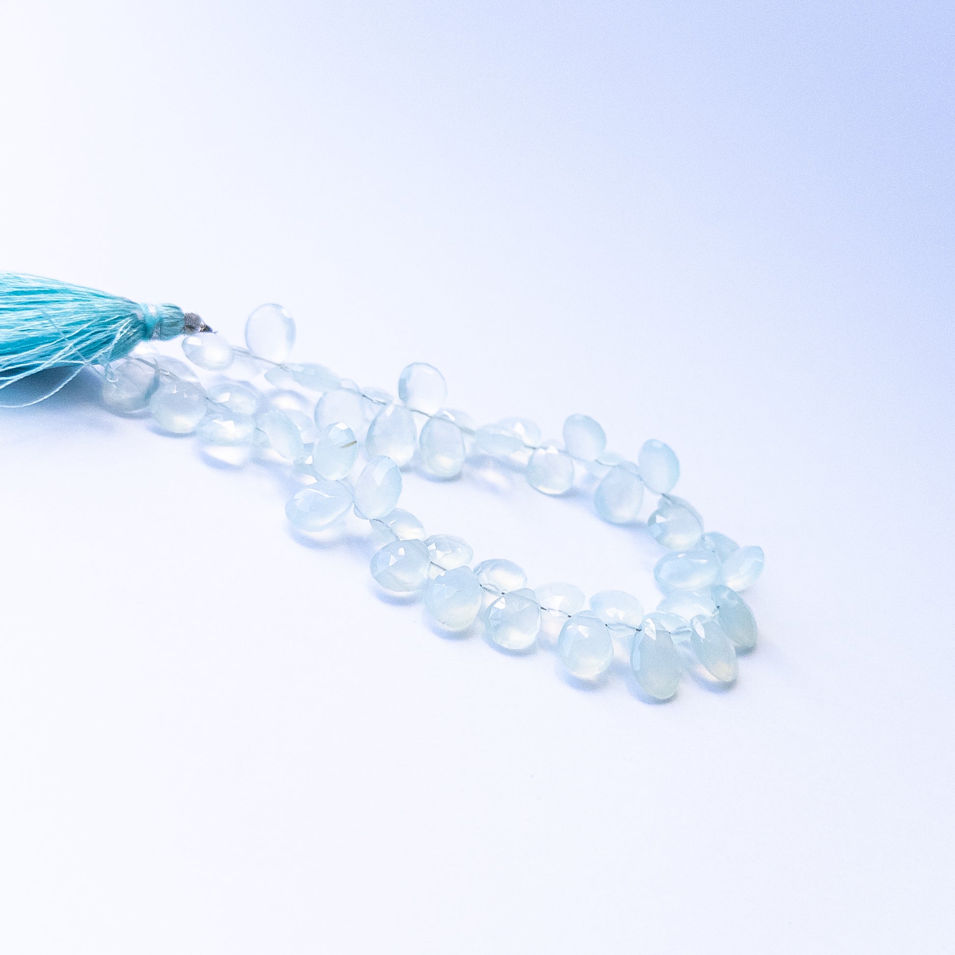 Chalcedony faceted briolette gemstone beads in 7–8mm sizes, genuine stones for handmade jewellery.